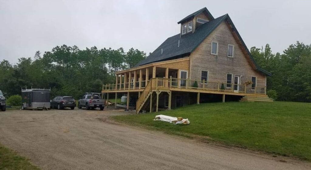 a custom deck built onto an existing home in Maine
