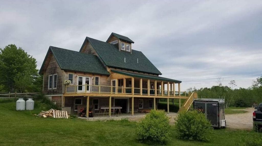 a custom deck built onto an existing home in Maine